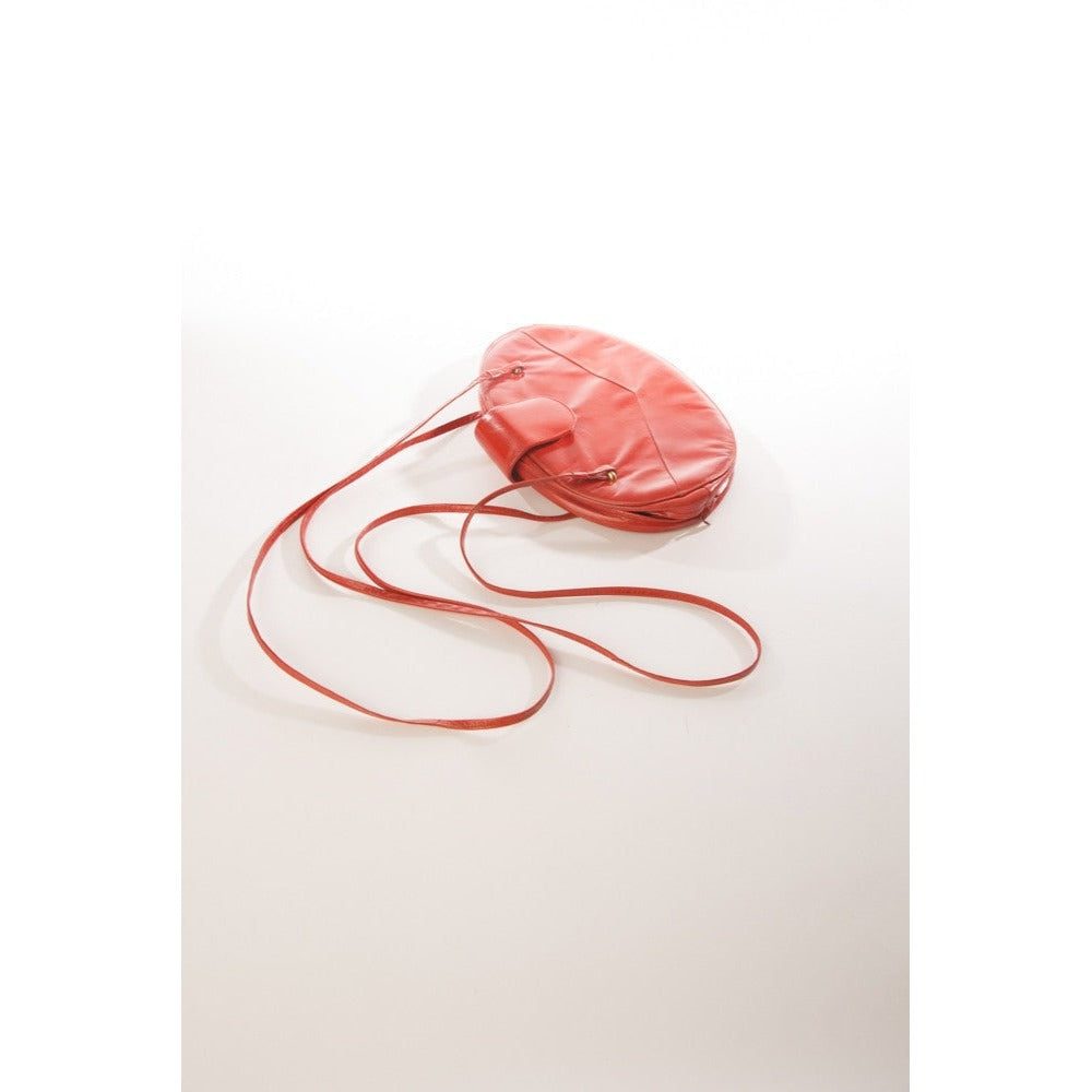Allure's Scarlet Elegance: Gorgeous Oval-Shaped Red Leather Handbag