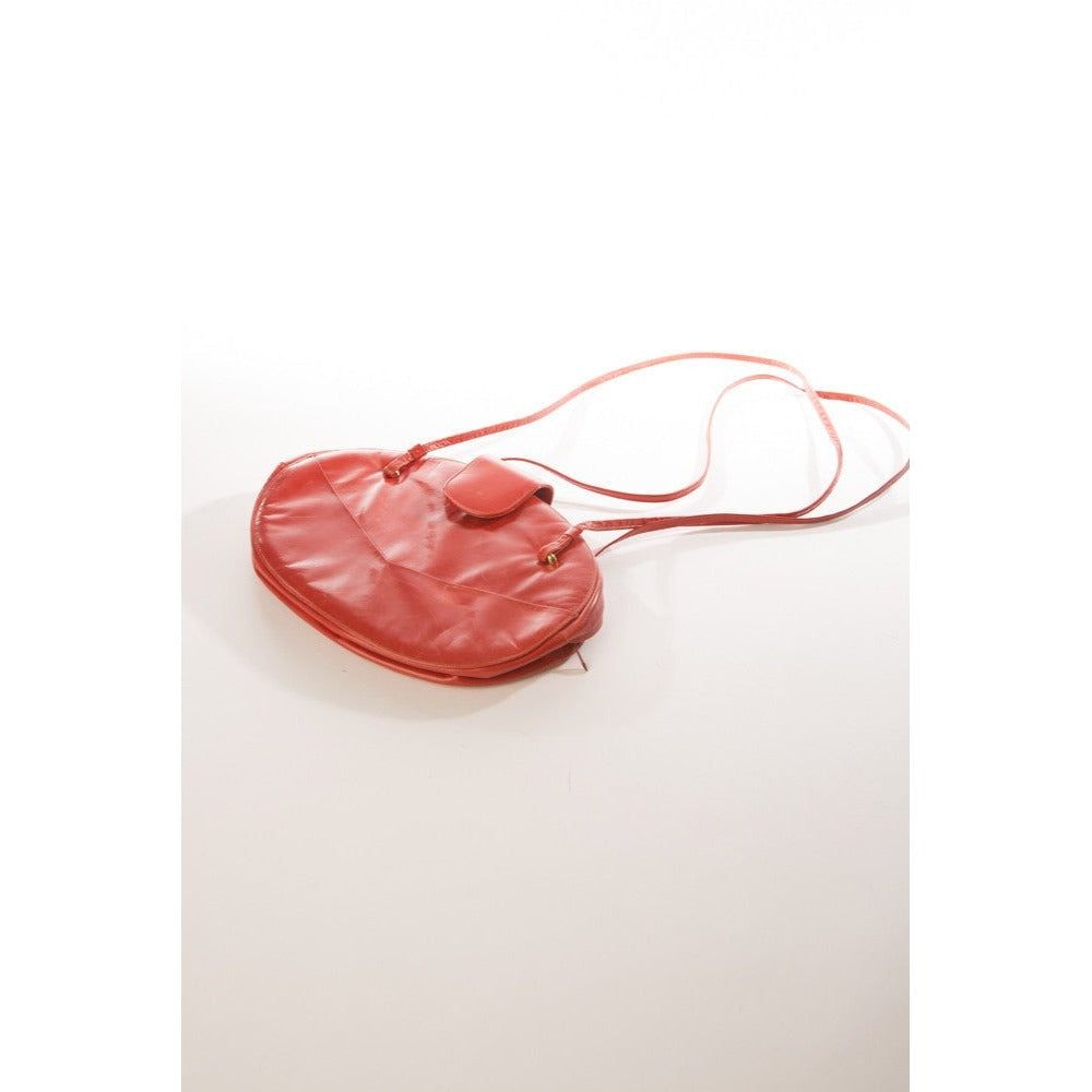 Allure's Scarlet Elegance: Gorgeous Oval-Shaped Red Leather Handbag