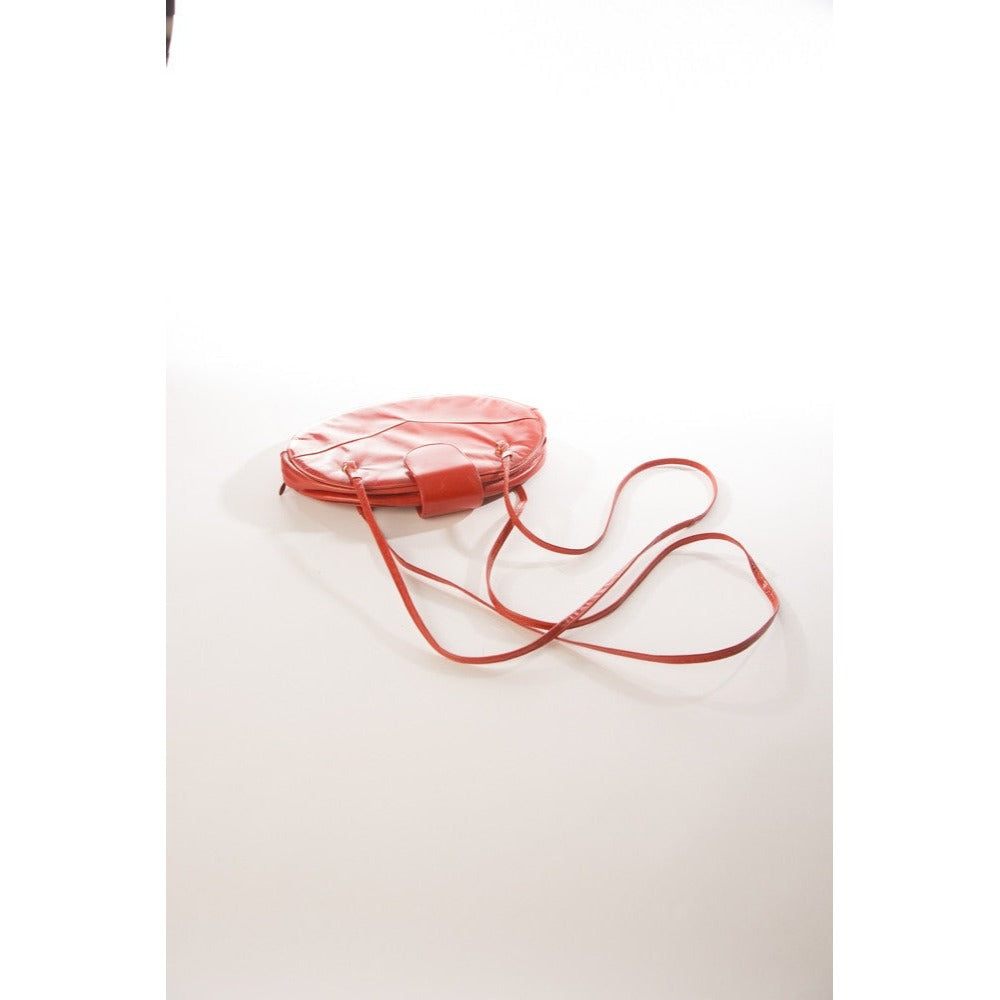 Allure's Scarlet Elegance: Gorgeous Oval-Shaped Red Leather Handbag