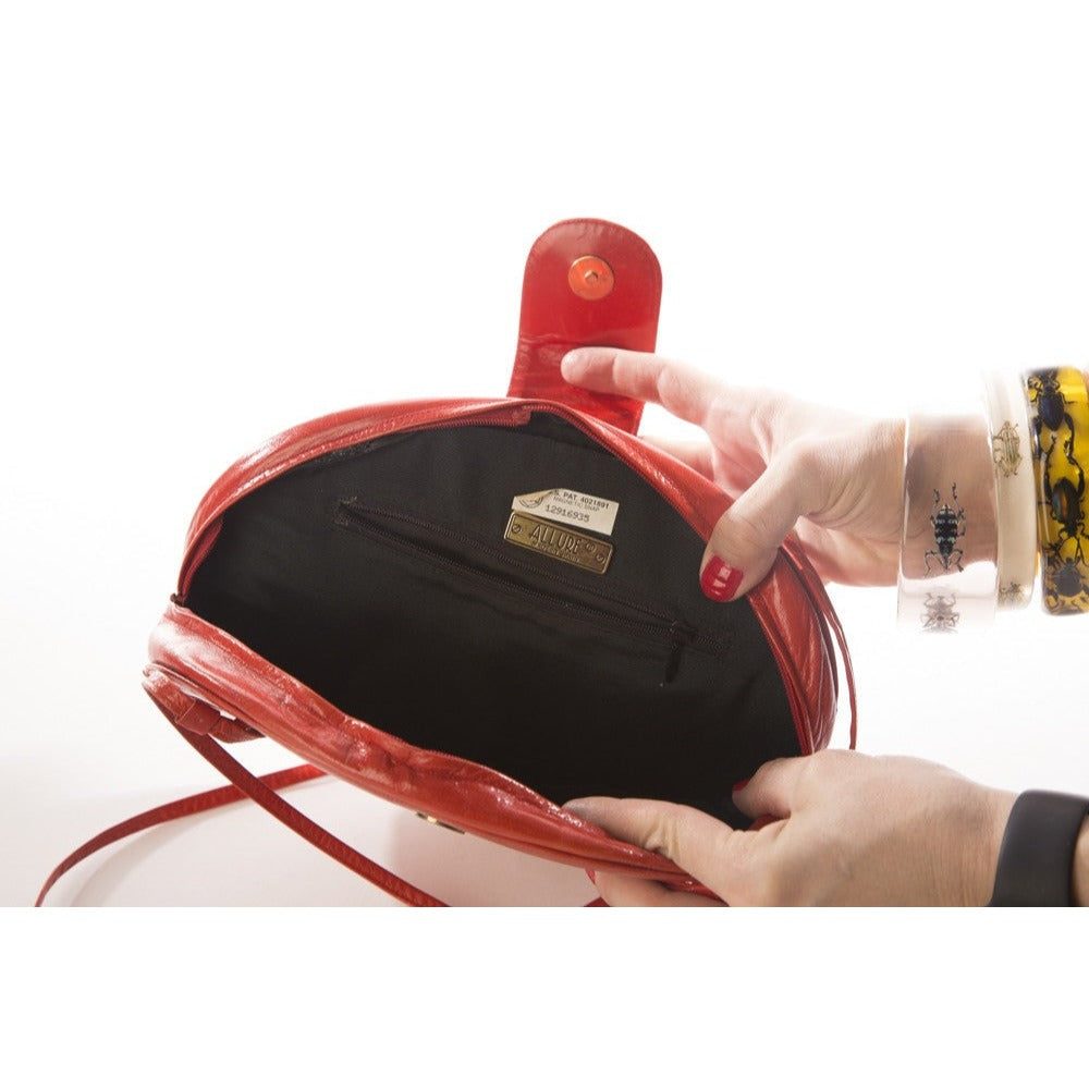 Allure's Scarlet Elegance: Gorgeous Oval-Shaped Red Leather Handbag