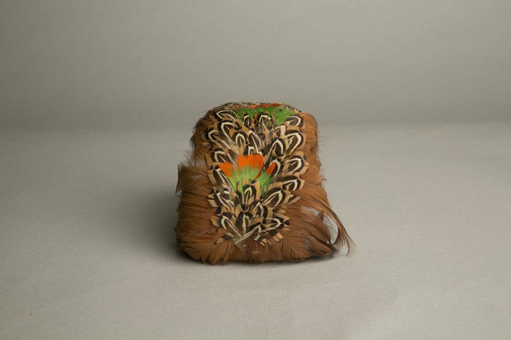 Vintage feathered toque hat with orange, green, and brown bird feathers, handmade fascinator millinery from 1970s.
