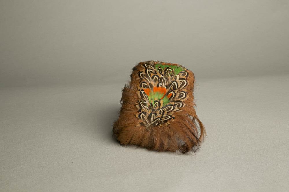 Vintage feathered toque hat in orange, green, and brown feathers from the 1970s.