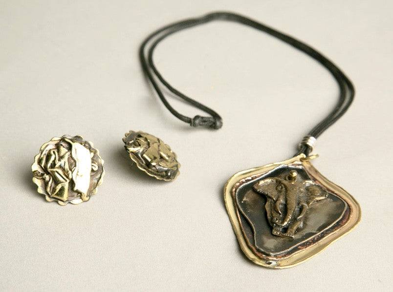 Handcrafted wild elephant jewelry set featuring necklace and earrings from Ohio Art Fair.
