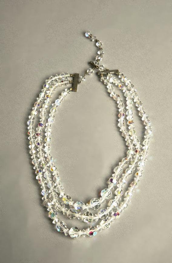 Crystal vintage jewelry necklace with multi-strand clear faceted beads from 1950s.