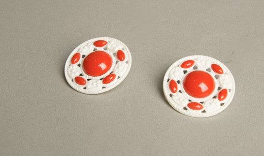 Retro red and white clip-on earrings, vintage carved plastic design.