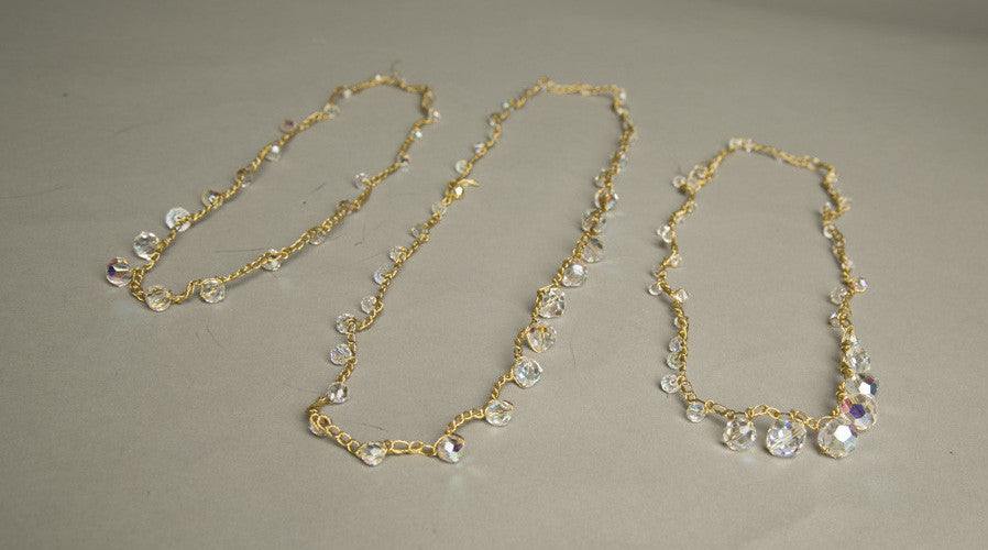 Set of 3 crystal necklaces with golden knit chains, vintage 1980s.