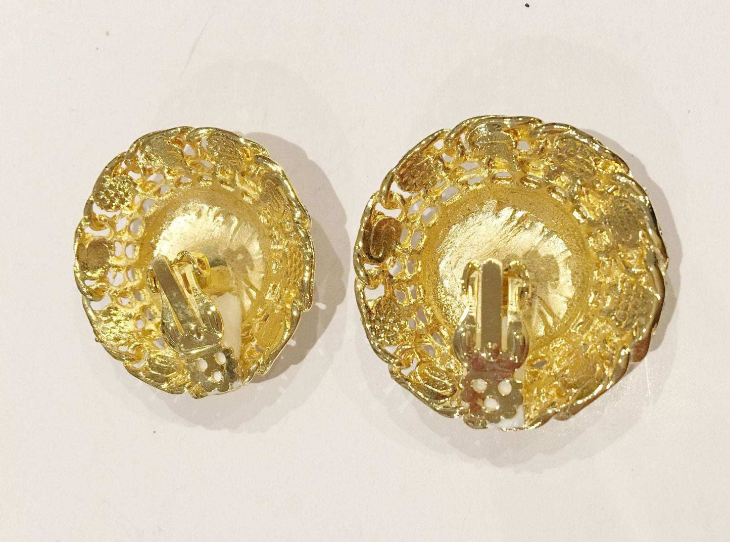 Brushed golden clip on earrings, vintage 1980s-90s jewelry with textured metal, 1.5-inch diameter.