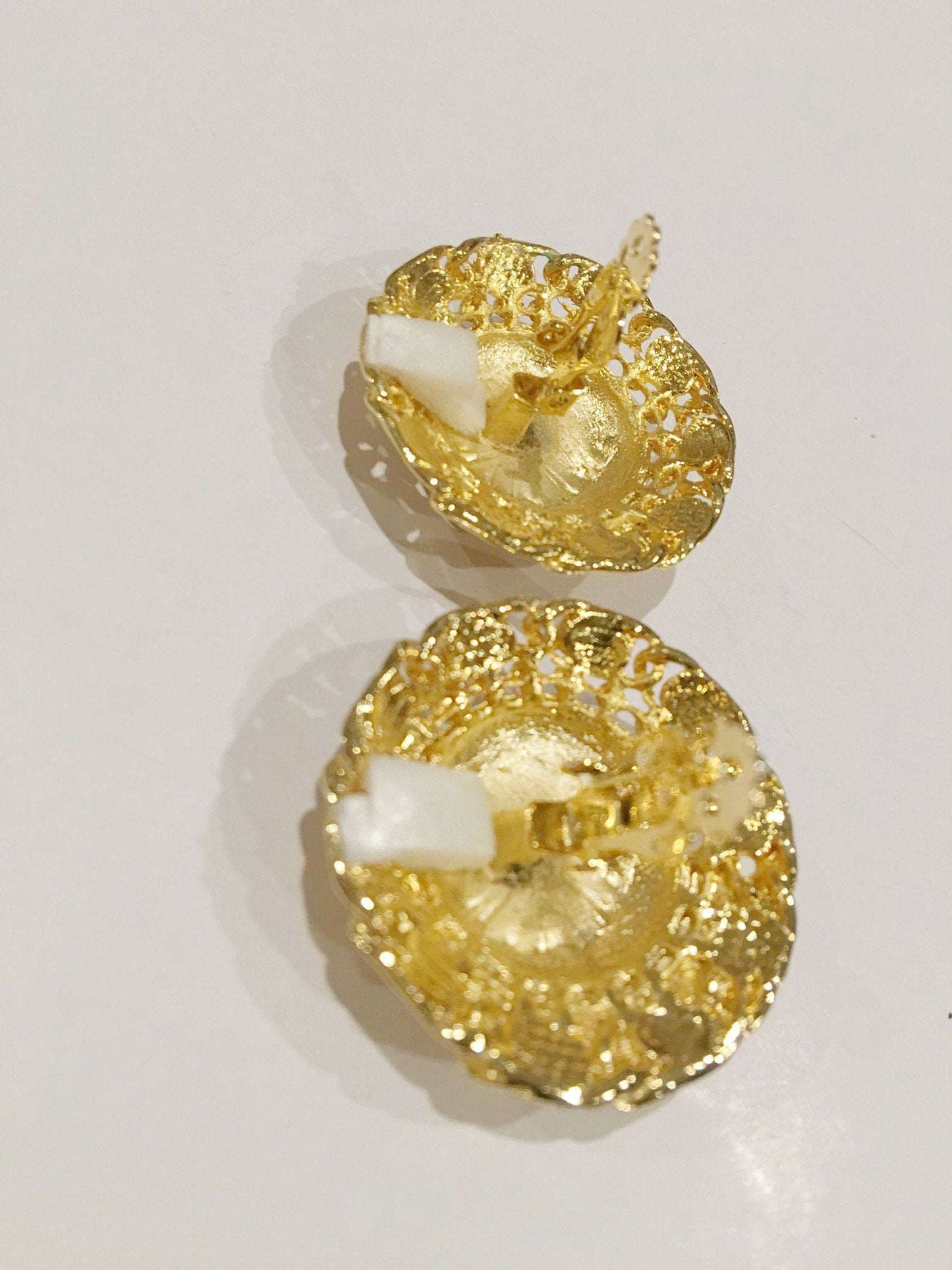 Brushed golden clip-on earrings, vintage 1980s-90s, with textured surface, 1.5 inches.
