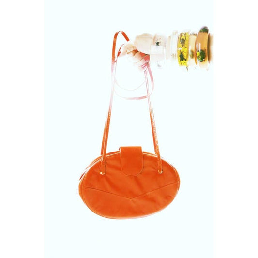 Allure's Scarlet Elegance: Gorgeous Oval-Shaped Red Leather Handbag