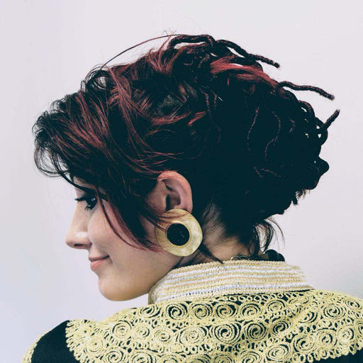 Merlusa Hercules Clip on vintage earrings with golden modernist design and Greek face on black, 1980s-90s.