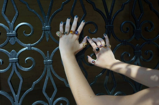 Vintage Avon Seed Pearls ring with simulated onyx and bead detailing on hand.
