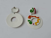 White colorful clip on earrings with pink, yellow, orange, and green swirls on white enamel, vintage 1960s-70s.