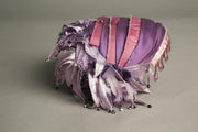 Blazsak Vintage Toque Hat with handmade crystals and beaded details on purple silk fabric.