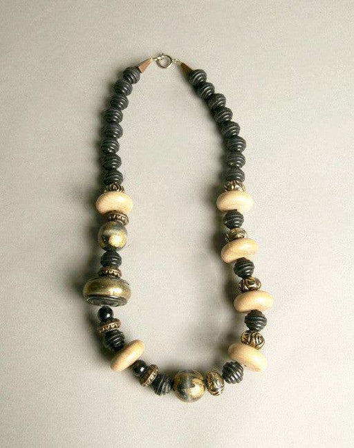 Ethnic tribal chic necklace with golden black wooden plastic beads.