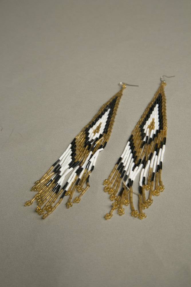 Handmade shoulder duster earrings with golden, silver, and white beads, vintage 1980s-90s design.