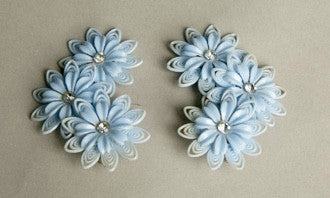Flower Child Fabulous vintage clip-on earrings with plastic flowers and rhinestones.