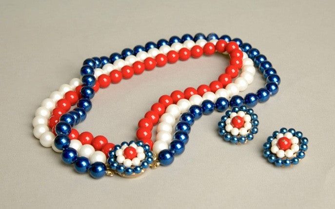 Vintage patriotic jewelry set with red, white, and blue beaded necklace and clip-on earrings.