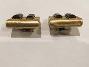 Modernist clip on earrings with brushed gold and black beads, vintage jewelry.