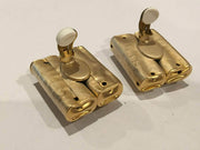 Modernist clip on earrings with brushed golden hammered metal and black beads, vintage 1980s-90s.