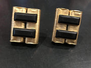 Modernist clip on earrings in golden hammered metal with black beads, vintage 1980s-90s.