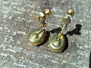 Miriam Haskell vintage red rhinestone earrings with gold findings, showcasing timeless elegance.