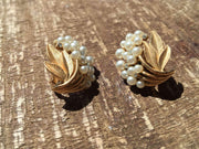 Vintage Trifari floral clip-on earrings with pearls and rhinestones.