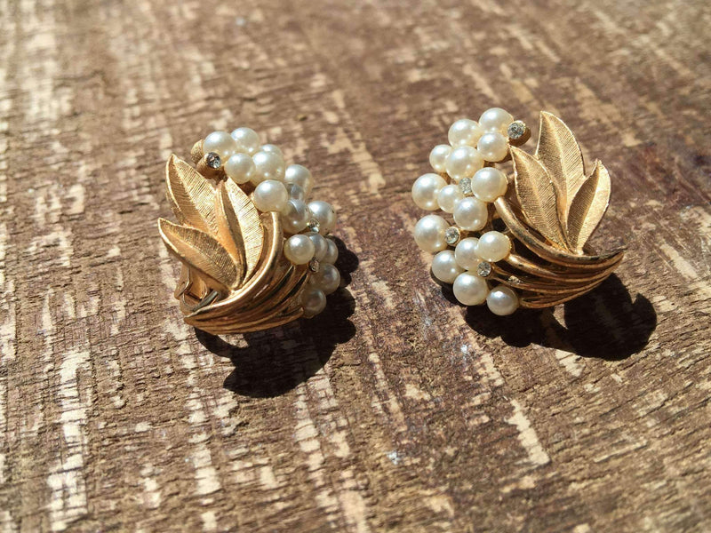 Vintage Trifari floral clip-on earrings with pearls and rhinestones.