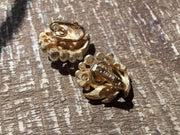 Vintage Trifari pearl floral clip-on earrings with rhinestones, in excellent condition.