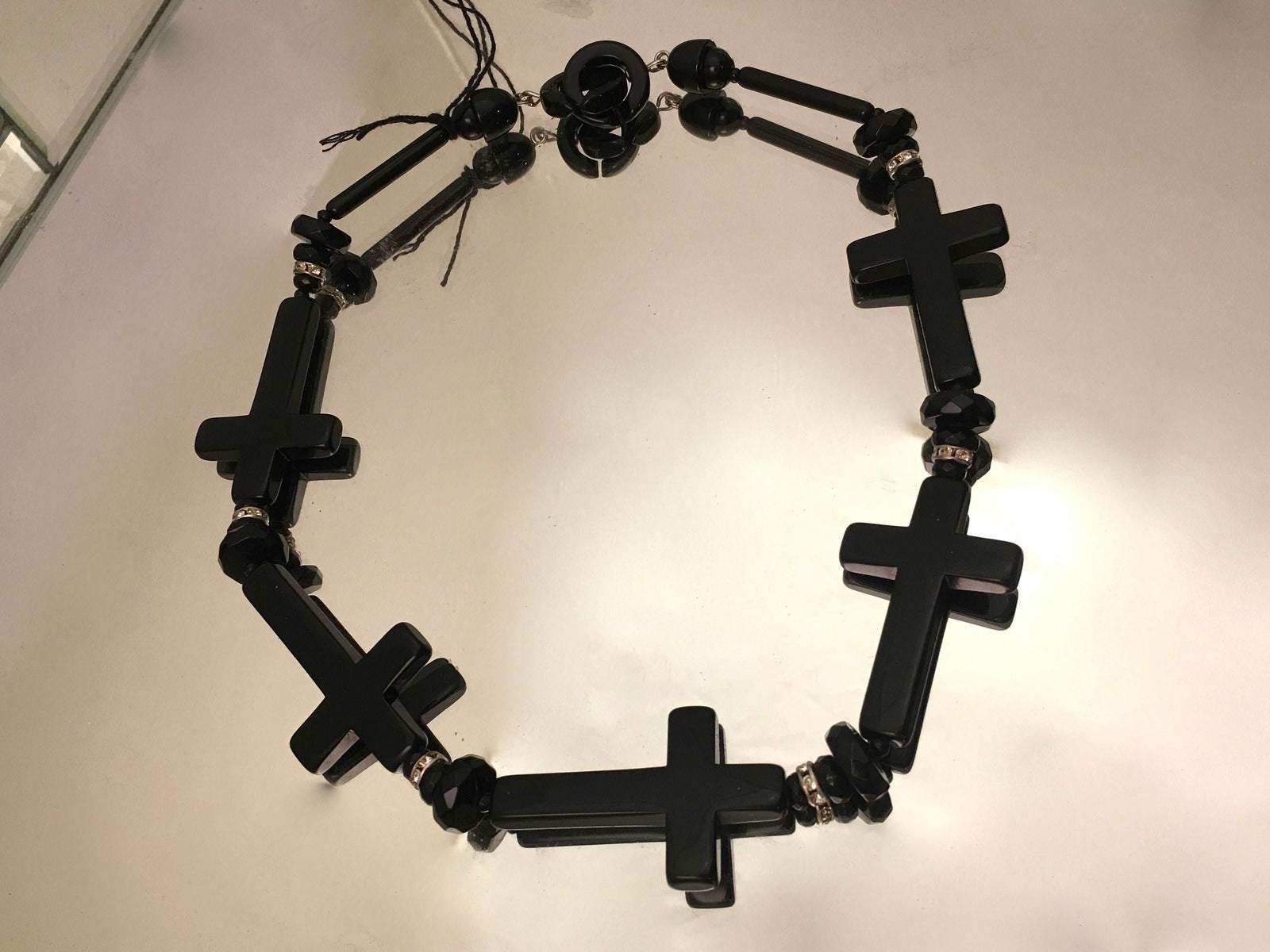 Cinematic Glamour: Angela Caputi Black Resin Cross Design Necklace
