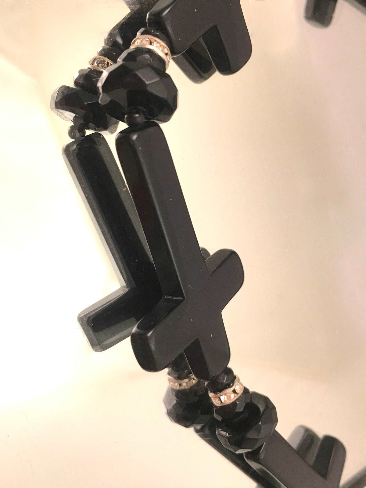 Cinematic Glamour: Angela Caputi Black Resin Cross Design Necklace