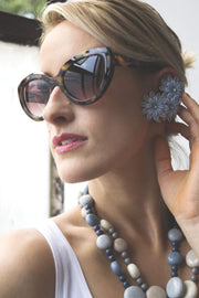 Flower Child Fabulous vintage clip on earrings with rhinestone flower design.